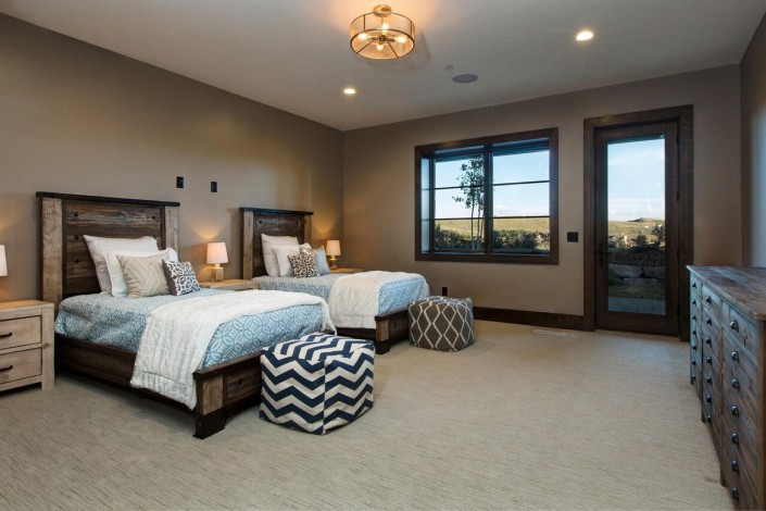 Promontory Rambler - Park City Custom Home Interior Bedroom with two beds nd exterior door